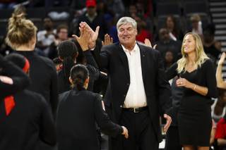 Head Coach Bill Laimbeer and Assistant Coach Kelly Raimon, back right, high five the Las Vegas Aces at the start of the Aces' home opener against the Los Angeles Sparks at Mandalay Bay Event Center Sunday, May 26, 2019.