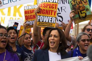 Democratic presidential candidate Sen. Kamala Harris, center, D-Calif., marches with Fight For 15 protestors during a demonstration by a McDonald's restaurant at Flamingo Road and Eastern Avenue in Las Vegas Friday, June 14, 2019. STEVE MARCUS