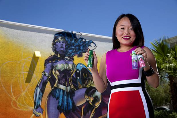 Elena Ledoux, CEO of Superb Maids and "chief mommy" for MommyGO energy shots, poses with energy shots outside her company's offices on South Jones Boulevard Wednesday, June 19, 2019.