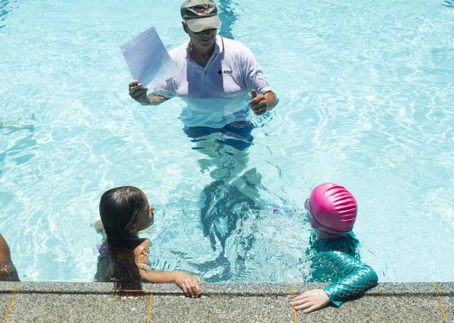 A swim instructor gives direction to participants during the World's Largest Swim Lesson event at the Boulder City Swimming Pool Thursday, June 20, 2019.  The World's Largest Swim Lesson is a world wide event to promote awareness and safety when swimming.