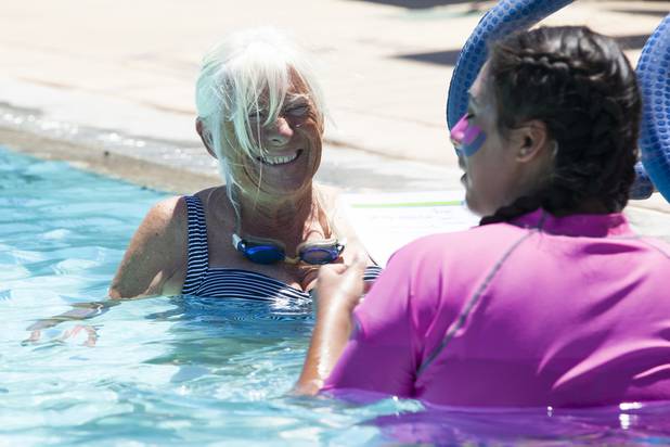 Valerie McMay from Boulder City receives instructions during the World's Largest Swim Lesson event at the Boulder City Swimming Pool Thursday, June 20, 2019.  The World's Largest Swim Lesson is a world wide event to promote awareness and safety when swimming.