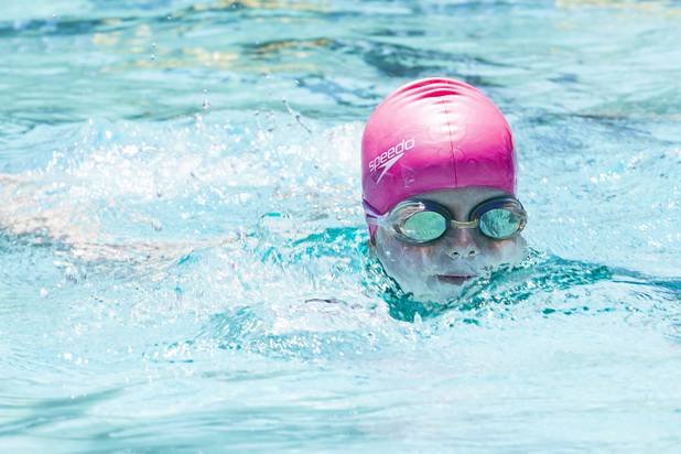 Leah, Tibbs, 6, practices swimming during the World's Largest Swim Lesson event at the Boulder City Swimming Pool Thursday, June 20, 2019.  The World's Largest Swim Lesson is a world wide event to promote awareness and safety when swimming.