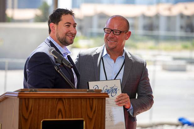 Michael Naft, left, Clark County commissioner, gives a proclamation to Christopher Beavor, CEO of CAI Investments, during a groundbreaking ceremony for a new Delta Hotel by Marriott at the southwest corner of Flamingo Road and Valley View Boulevard Wednesday, June 26, 2019.