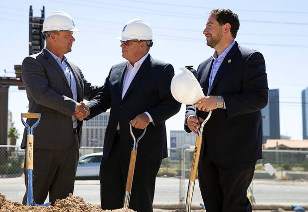 Christopher Beavor, left, CEO of CAI Investments, shakes hands with Michael Metcalf, COO of Crescent Hotels & Resorts during a CAI Investments groundbreaking ceremony for a new Delta Hotel by Marriott at the southwest corner of Flamingo Road and Valley View Boulevard Wednesday, June 26, 2019. Clark County Commissioner Michael Naft looks on at right.