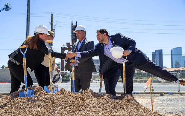 Clark County Commissioner Michael Naft, right, stretches to shake hands with Jennifer McLennan, global brand leader for Delta Hotels by Marriott, during a CAI Investments groundbreaking ceremony for a new Delta Hotel by Marriott at the southwest corner of Flamingo Road and Valley View Boulevard Wednesday, June 26, 2019.