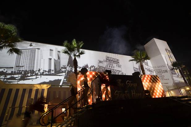 Vintage photos of Las Vegas are projected onto the casino during an event celebrating the return of the Sahara name to the SLS Las Vegas at the casino Thursday, June 27, 2019.