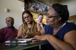 Former inmate Ora Watkins registers to vote on the effective date of Assembly Bill 431 at the First AME Church Monday, July 1, 2019. The bill restores voting rights to formerly incarcerated individuals automatically once they are released from prison.