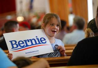 Prosper Hicks, 6, shows off her button as she waits for a town hall event with Democratic presidential candidate Sen. Bernie Sanders, I-Vt., at the Victory Missionary Baptist Church Saturday, July 6, 2019.