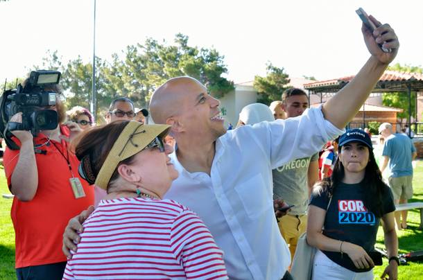 Democratic presidential candidate U.S. Sen. Cory Booker takes a selfie with Reyna Bernal during the 71st Annual Boulder City Damboree Celebration in Boulder City on Thursday, July 4, 2019.