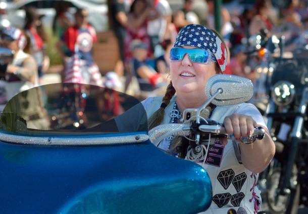 Bling Devas Motorcycle Club member Shannon Venturo rides in the Fourth of July parade during the 71st Annual Boulder City Damboree Celebration in Boulder City on Thursday, July 4, 2019.