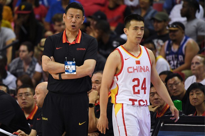 China coach Li Nan talks to guard Jiwei Zhao during ...