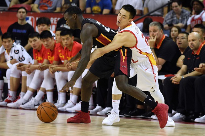 China guard Jiwei Zhao fouls Miami Heat forward Kendrick Nunn ...