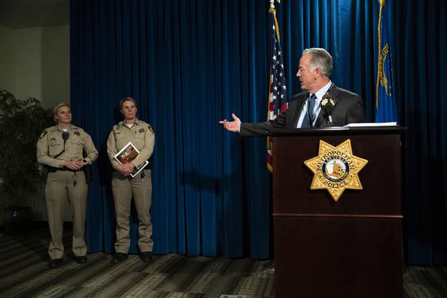 Clark County Sheriff Joe Lombardo introduces the authors of the 1 October After-Action Review report Detective Stephanie Ward, left, and Capt. Kelly McMahill during a news conference at Metro Police headquarters on Wednesday, July 10, 2019.