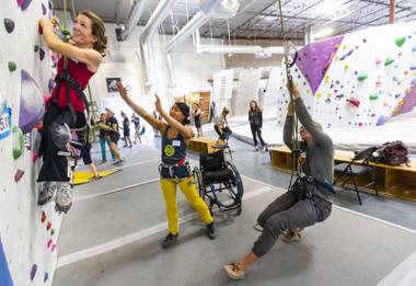 Ashlee Kalina climbs during an adaptive recreation meetup at Origin Climbing & Fitness in Henderson, Nev., on Sunday, June 23, 2019.