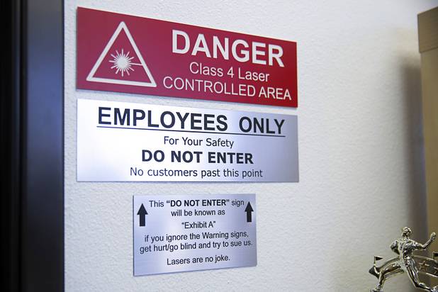 A warning sign is displayed at Lazer Ladies, a veteran-owned small business, in North Las Vegas Friday, July 12, 2019. Sen. Jacky Rosen, D-Nev. visited the business to unveil her Veterans Jobs Opportunity Act which will provide tax credit for veterans who start a small business in underserved communities.