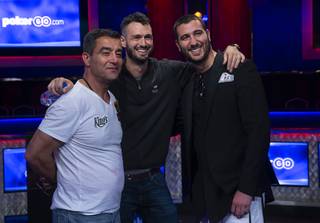 Hossein Ensan, left, Alex Livingston, center, and Dario Sammartino, pose at the end of the second day during the World Series of Poker Main Event final table at the Rio hotel-casino in Las Vegas Monday, July 15, 2019.