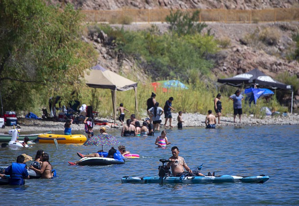 People enjoy the Colorado River at Willow Beach, Ariz. in the Lake Mead National Recreation Area Saturday, July 13, 2019.