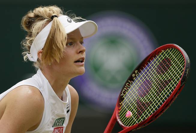 Harriet Dart prepares to receive serve from Ashleigh Barty in a women's singles match July 6 at the Wimbledon Tennis Championships in London.