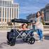 Brand ambassador Rachel Segovia, pushes Addison Segovia, 7, in a stroller from Main Street Strollers, a stroller rental company, Tuesday, July 30, 2019.