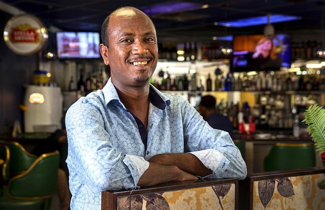 Co-owner Fitsumberhan Mehari poses at Lucy's Ethiopian Restaurant, 4850 W. ...
