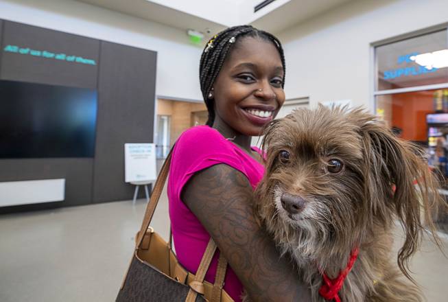 Brittnee Williams poses with Zaira after adopting the dog during "Clear the Shelters Day" at the Animal Foundation's GreenGale Campus, 655 Mojave Rd., Saturday, Aug. 17, 2019. Adoption fees were waived for the annual one-day event, part of a national effort to connect shelter pets with new homes.