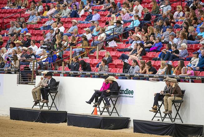 Judges watch a performance during the $50,000 Added Invitational Freestyle competition at the South Point Arena Saturday, Aug. 17, 2019. The event was part of "The Run For a Million," the world's richest reining championship event, which was filmed for Paramount Network's "The Last Cowboy."