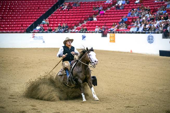 Bub Poplin of Fruita, Colo. and his horse Smokin Custom Chrome perform a sliding stop during the $50,000 Added Invitational Freestyle competition at the South Point Arena Saturday, Aug. 17, 2019. The event was part of "The Run For a Million," the world's richest reining championship event, which was filmed for Paramount Network's "The Last Cowboy."