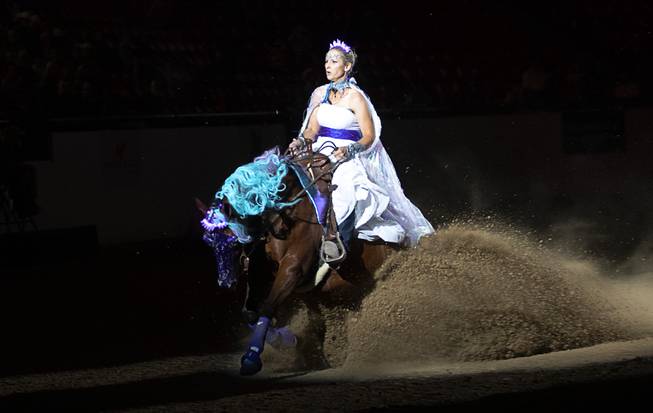 Kirstin Booth of Temucula, Calif. and her horse Babys Got Blue Eyes perform a sliding stop during the $50,000 Added Invitational Freestyle competition at the South Point Arena Saturday, Aug. 17, 2019. The event was part of "The Run For a Million," the world's richest reining championship event, which was filmed for Paramount Network's "The Last Cowboy."