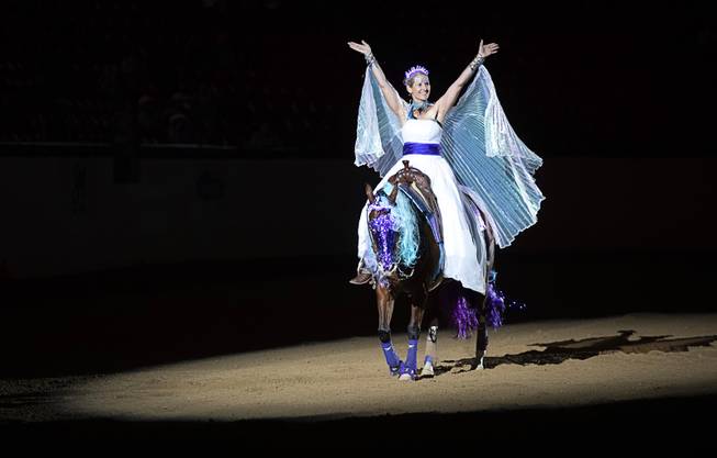 Kirstin Booth of Temucula, Calif. waves to the audience after competing in the $50,000 Added Invitational Freestyle competition at the South Point Arena Saturday, Aug. 17, 2019. The event was part of "The Run For a Million," the world's richest reining championship event, which was filmed for Paramount Network's "The Last Cowboy."