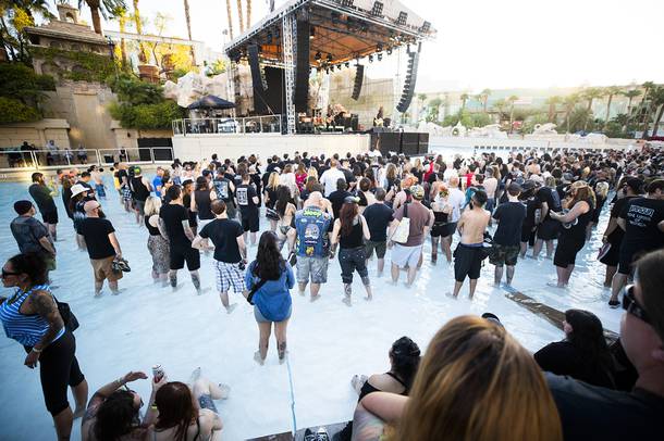 Festivalgoers stand in the beach wave pool during YOB's performance at Psycho Las Vegas music festival at Mandalay Bay Friday, Aug. 16, 2019.
