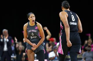 Las Vegas Aces center A'ja Wilson, left, (22) celebrates with Liz Cambage (8) after scoring in overtime during a WNBA basketball game against the Phoenix Mercury at the Mandalay Bay Events Center Tuesday, Aug. 20, 2019. The Aces beat the Mercury 84-79.