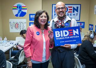 Former Secretary of Labor Hilda Solis poses for a photo with Biden supporter Gil Lopez at the Biden for President campaign office in Las Vegas Thursday, Aug. 29, 2019.