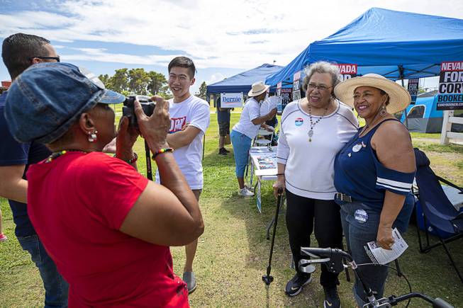 Carolyn Booker, center, mother of Democratic presidential candidate Sen. Cory Booker, D-N.J., poses for a photo with Twila Burns during Congressman Steven Horsford's Labor Day Cookout at Craig Ranch Regional Park in North Las Vegas, Sept. 2, 2019.
