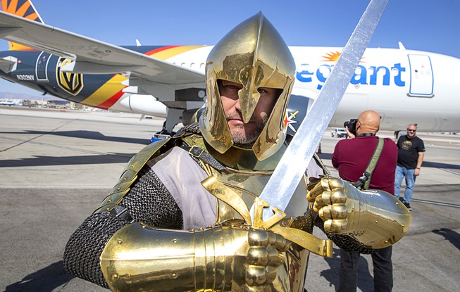 The Vegas Golden Knight poses by an Allegiant Air Airbus ...