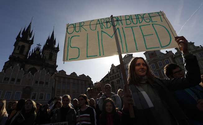 A girl holds a sign during a protest at the ...