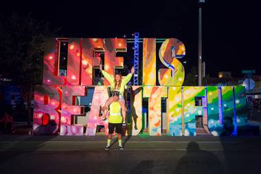 A couple poses for a photo during day 1 of the Life is Beautiful festival in downtown Las Vegas, Friday Sept 20, 2019.