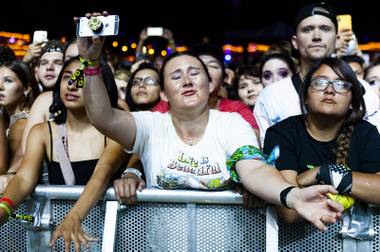 A fan sings during Post Malone’s performance during the third and last day of the Life Is Beautiful festival Sunday, Sept. 22, 2019.