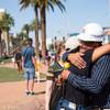 A woman embraces Greg Zanis, who has placed 58 crosses near the Welcome to Las Vegas sign Tues. Oct. 1, 2019, in honor of those that lost their lives on this day, two years ago, during the Route 91 Harvest Festival shooting.