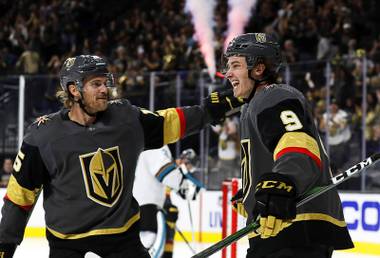 Golden Knights defenseman Jon Merrill, left, congratulates center Cody Glass after he scored against the San Jose Sharks during the second period of an NHL hockey game Wednesday, Oct. 2, 2019, in Las Vegas. 