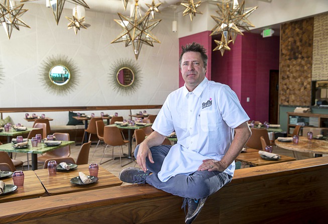 John Simmons poses in his latest restaurant, Firefly Tapas Kitchen ...