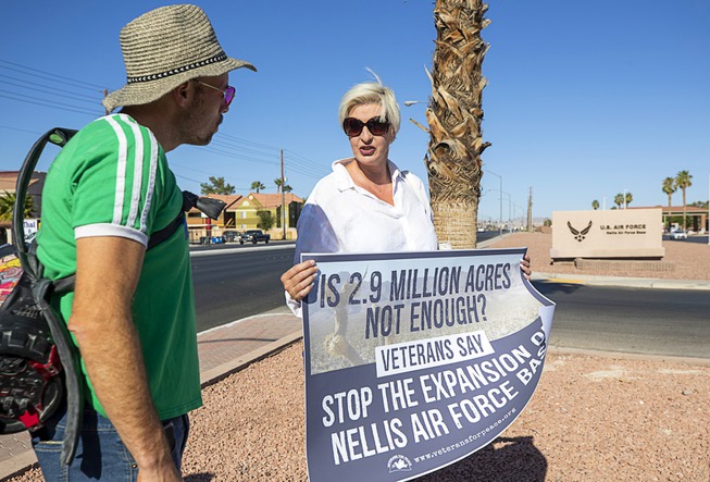 Gabrielle D'Ayr of Las Vegas holds a sign during a ...