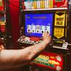A local gambler plays simultaneously on two coin slot machines after winning a big jackpot at El Cortez Casino, Wednesday, Oct. 2, 2019.