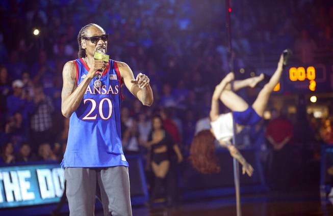In this Friday, Oct. 4, 2019 photo, rapper Snoop Dogg performs during Late Night in the Phog, Kansas' annual NCAA college basketball kickoff, at Allen Fieldhouse in Lawrence, Kan. 

