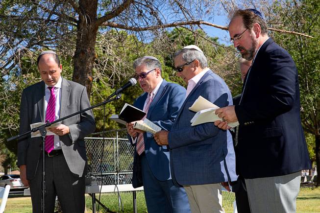 Rabbi Malcolm Cohen, from left, Rabbi Felipe Goodman, Jared Finkelstein and Rabbi Sanford Akselrad conduct indigent Jewish burials at Woodlawn Cemetery, where headstones were unveiled for 64 Jews, Sunday, Oct. 6, 2019. 