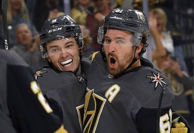 Vegas Golden Knights right wing Mark Stone, right, celebrates a goal with center Cody Glass (9) during the first period of a game at T-Mobile Arena Tuesday, Oct. 15, 2019.