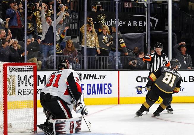 Fans react after Golden Knights' center Jonathan Marchessault (81) scores past Ottawa Senators' goaltender Anders Nilsson (31) to win a shootout at T-Mobile Arena Friday, Oct. 17, 2019.