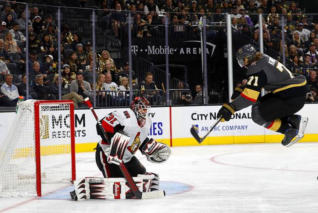 Golden Knights' center William Karlsson (71) jumps to get out of the way as a teammate (not pictured) takes a shot on Ottawa Senators' goaltender Anders Nilsson (31) during the third period of a game against the Ottawa Senators at T-Mobile Arena Friday, Oct. 17, 2019.