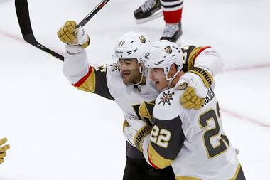 Golden Knights left wing Max Pacioretty (67) celebrates with Nick Holden after Holden’s game-tying goal during the third period of the team’s NHL hockey game against the Chicago Blackhawks on Tuesday, Oct. 22, 2019, in Chicago. The Golden Knights won in a shootout, 2-1.