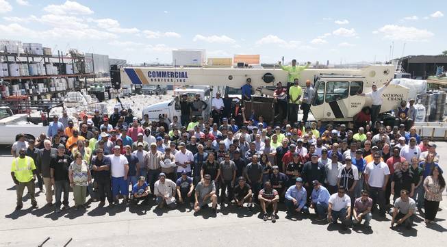 Staff members at Commercial Roofers Inc. gather for a photo outside the company’s Las Vegas headquarters. 
