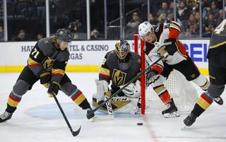Vegas Golden Knights center William Karlsson (71) and Anaheim Ducks center Troy Terry (61) vie for the puck during the first period of an NHL hockey game Sunday, Oct. 27, 2019, in Las Vegas.